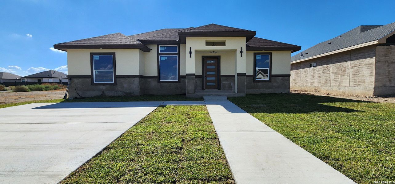 Front exterior of a new home in , Eagle Pass, TX, highlighting curb appeal (Image 11).