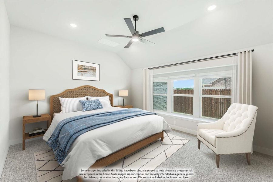 Bedroom with vaulted ceiling, ceiling fan, carpet flooring, and large windows with natural light