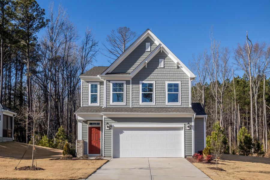 Front exterior of a new home in Daniel Farms, Benson, NC, highlighting curb appeal (Image 1). Front exterior of a new home in Daniel Farms, Benson, NC, highlighting curb appeal (Image 1).