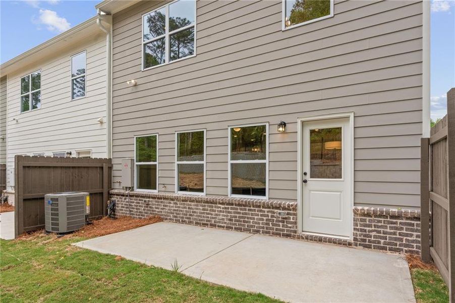 Exterior details and patio area of a home in River Walk Place, Lawrenceville (Image 4).