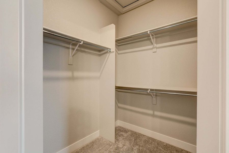 Primary Closet - Not Actual Home - Finishes May Vary