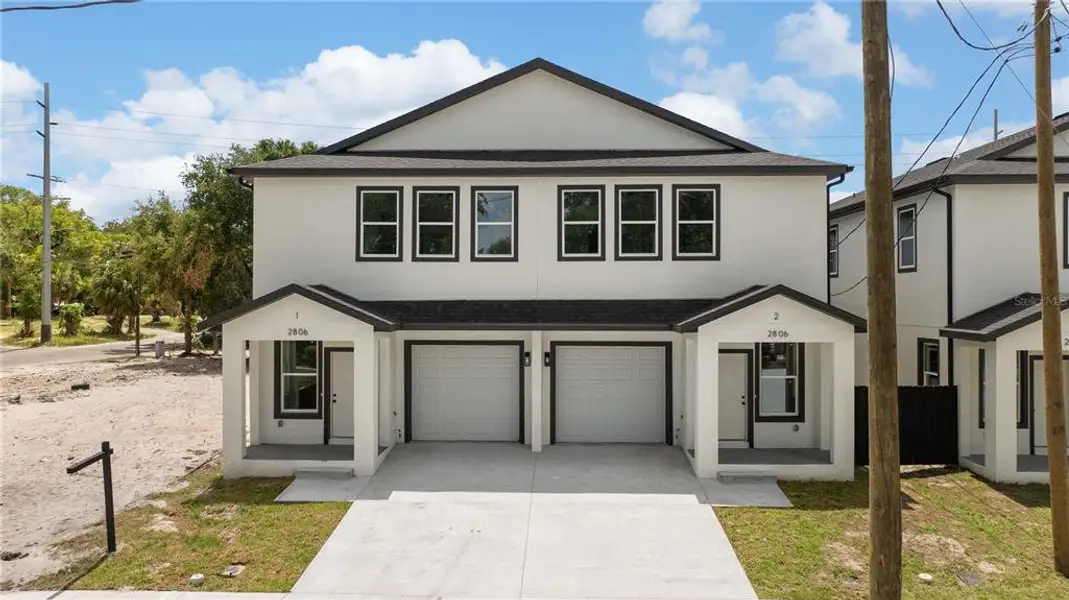 Front exterior of a new home in , Tampa, FL, highlighting curb appeal (Image 21). Front exterior of a new home in , Tampa, FL, highlighting curb appeal (Image 21).