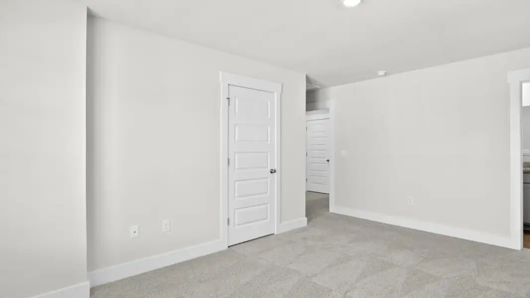 Spacious, unfurnished interior of a new home in The Townes at Cedar Hill Landing, Navassa (Image 21).
