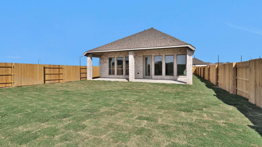 Exterior details and patio area of a home in Elyson 45', Katy (Image 3).