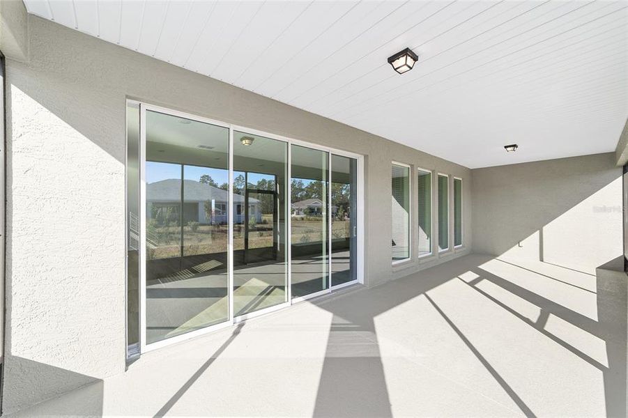 Exterior details and patio area of a home in On Top of the World Communities, Ocala (Image 3).