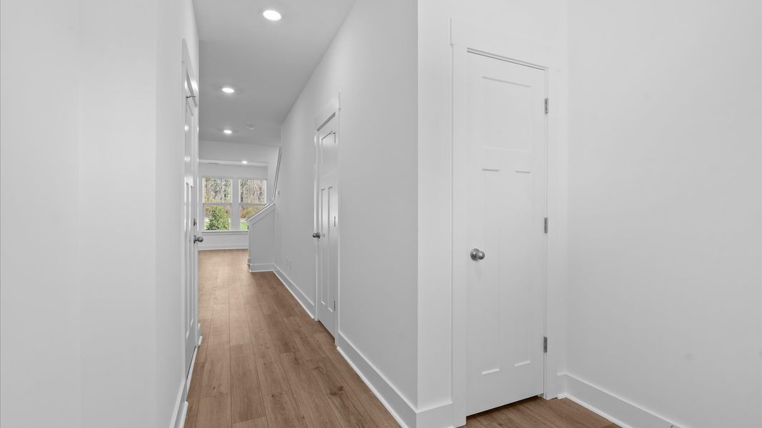 Elegant foyer with hardwood flooring and tasteful trim detail creates a memorable first impression at Gresham Station