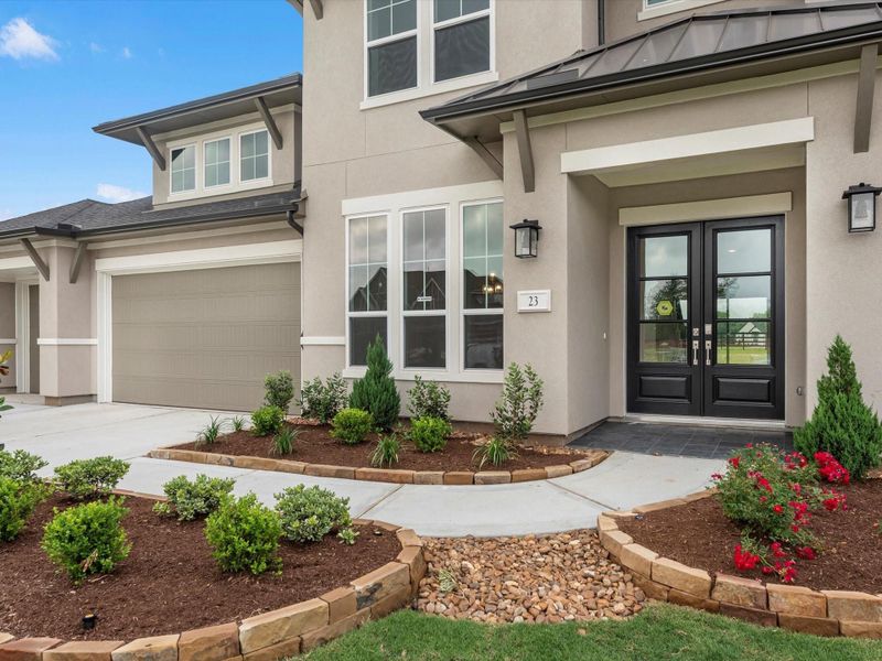 Front exterior of a new home in The Estates at James Lane, Fulshear, TX, highlighting curb appeal (Image 18). Front exterior of a new home in The Estates at James Lane, Fulshear, TX, highlighting curb appeal (Image 18).