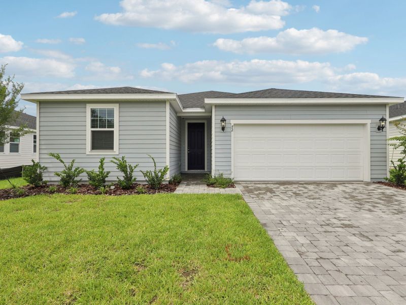 Front exterior of a new home in Colbert Landings, Palm Coast, FL, highlighting curb appeal (Image 12).