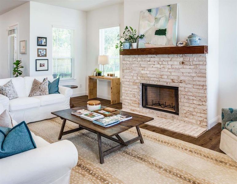 Living room featuring a fireplace and hardwood / wood-style floors