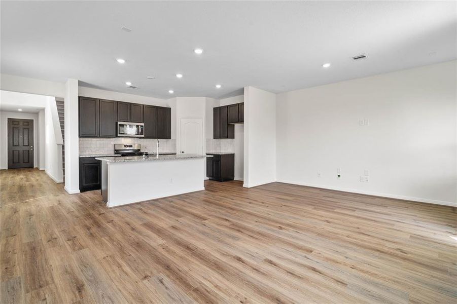 Additional view from the family room looking towards the kitchen and dining areas.