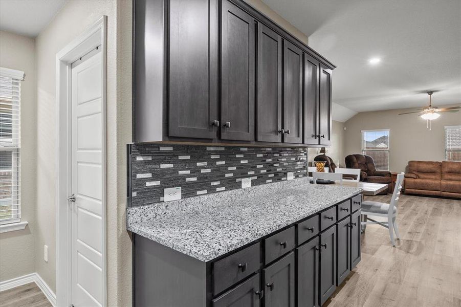 An abundance of custom cabinetry provides ample storage space An abundance of custom cabinetry provides ample storage space