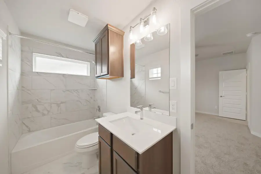 Furnished interior view inside a new home in Barton Creek Ranch, Conroe (Image 3).