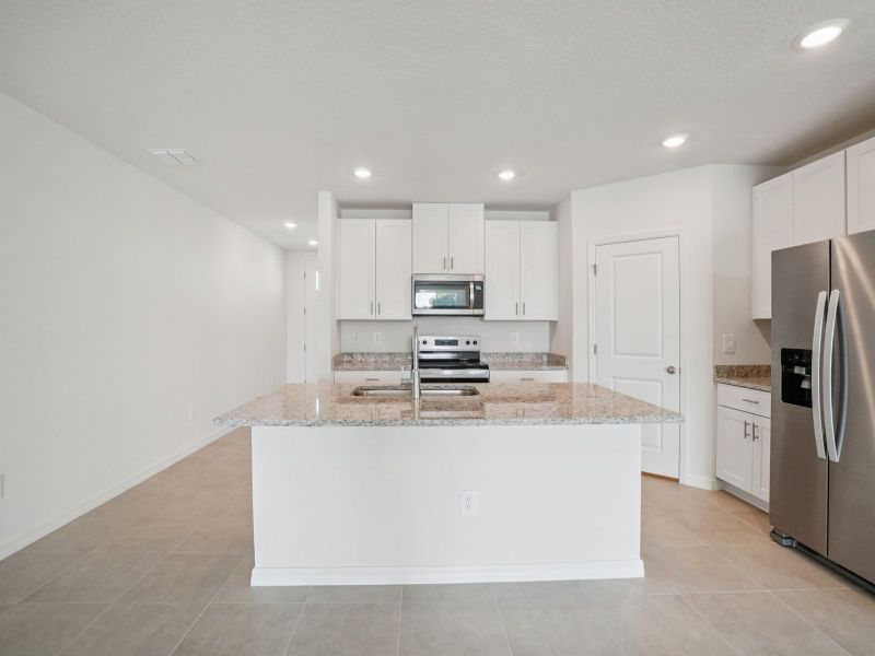 Furnished interior view inside a new home in Two Rivers - Classic Series, Zephyrhills (Image 6).