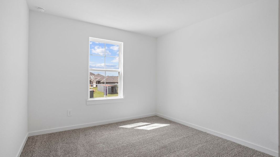 Representative unfurnished interior of a home built from the Mitchell by D.R. Horton in Caldwell Crossing, Iowa Colony (Image 24).