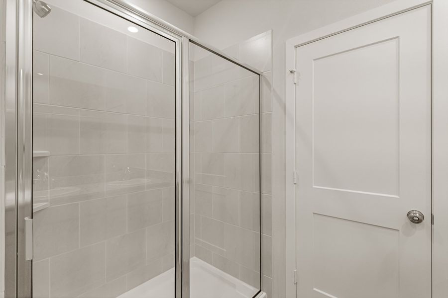 A shower with a glass door. A shower with a glass door.