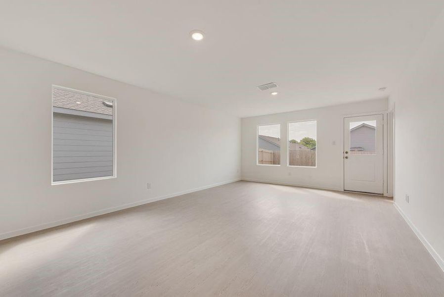 Unfurnished room with light wood-style flooring and recessed lighting