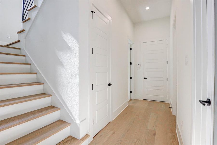 Hall featuring light hardwood / wood-style flooring