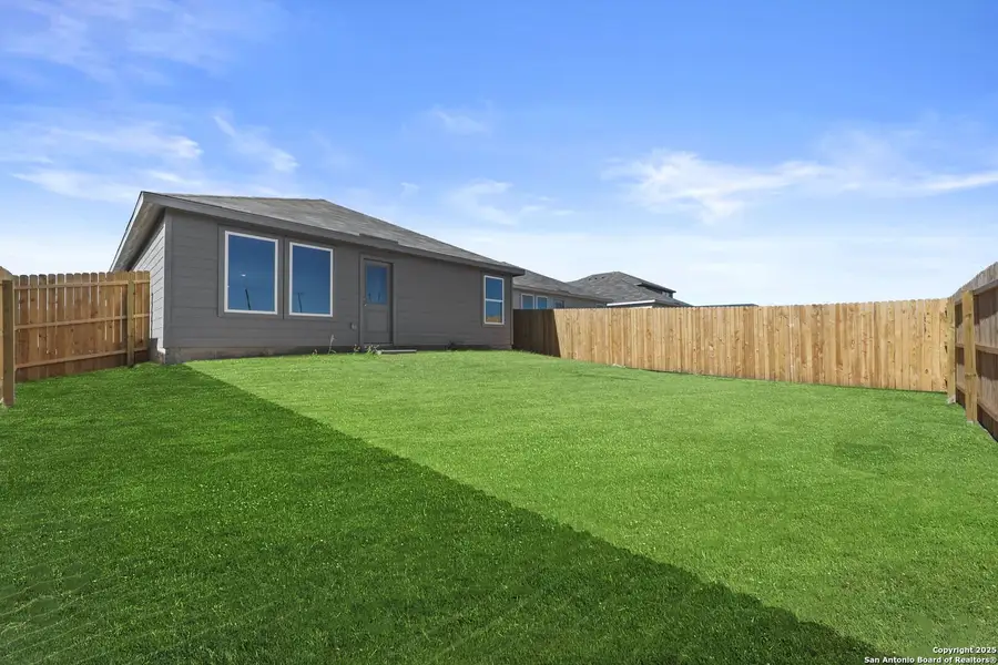 Exterior details and patio area of a home in Randolph Crossing: Cottage Collection, Converse (Image 2).