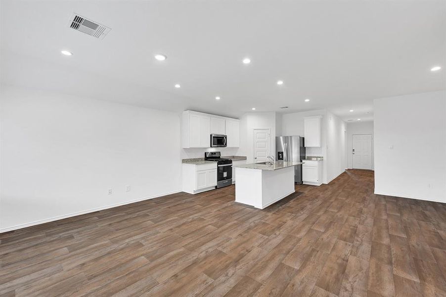 The kitchen is thoughtfully designed with an efficient layout, making it easy to store and access ingredients—so you can effortlessly create delicious meals for your family.