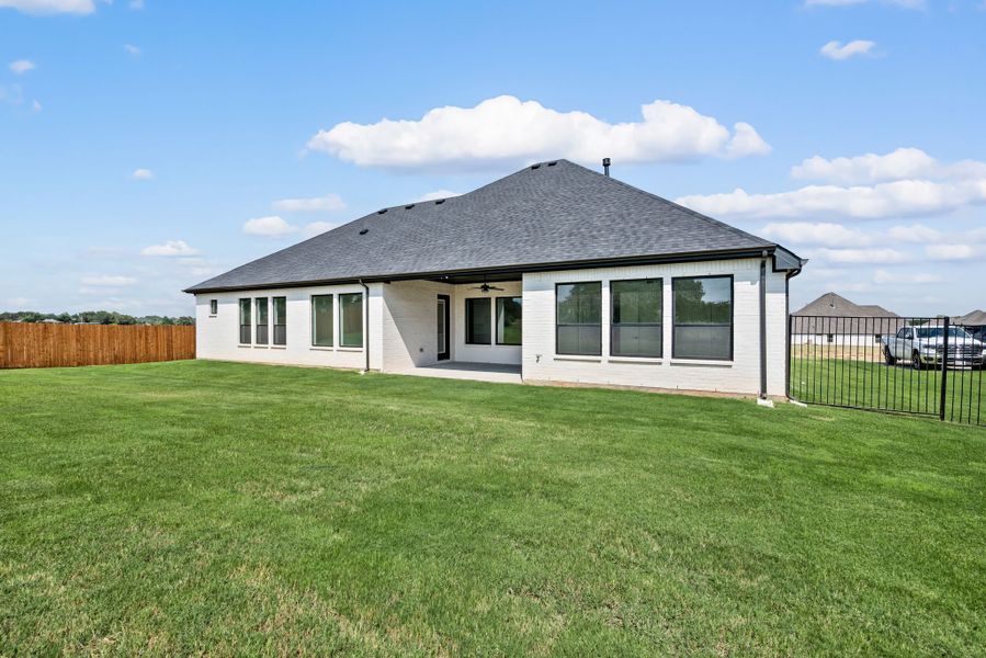 Front exterior of a new home in Highland Oaks, Boyd, TX, highlighting curb appeal (Image 24).