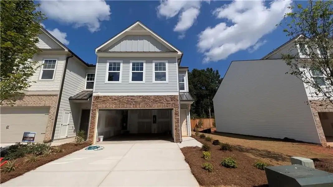 Front exterior of a new home in Owen Preserve, Canton, GA, highlighting curb appeal (Image 1). Front exterior of a new home in Owen Preserve, Canton, GA, highlighting curb appeal (Image 1).