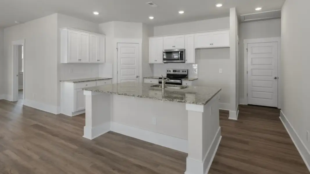 Furnished interior view inside a new home in The Retreat at Indigo Preserve Townhomes, Leland (Image 5).