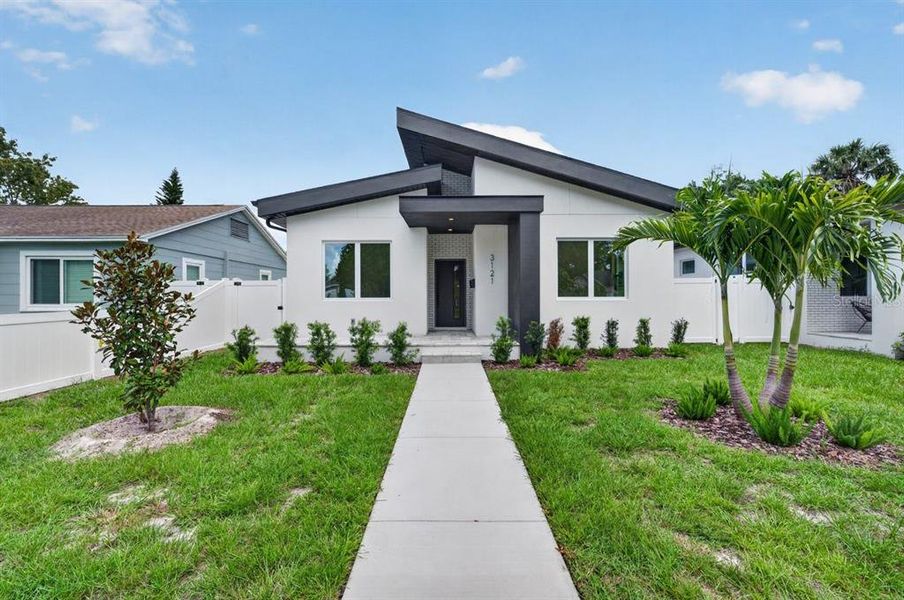 Front exterior of a new home in , St. Petersburg, FL, highlighting curb appeal (Image 17).