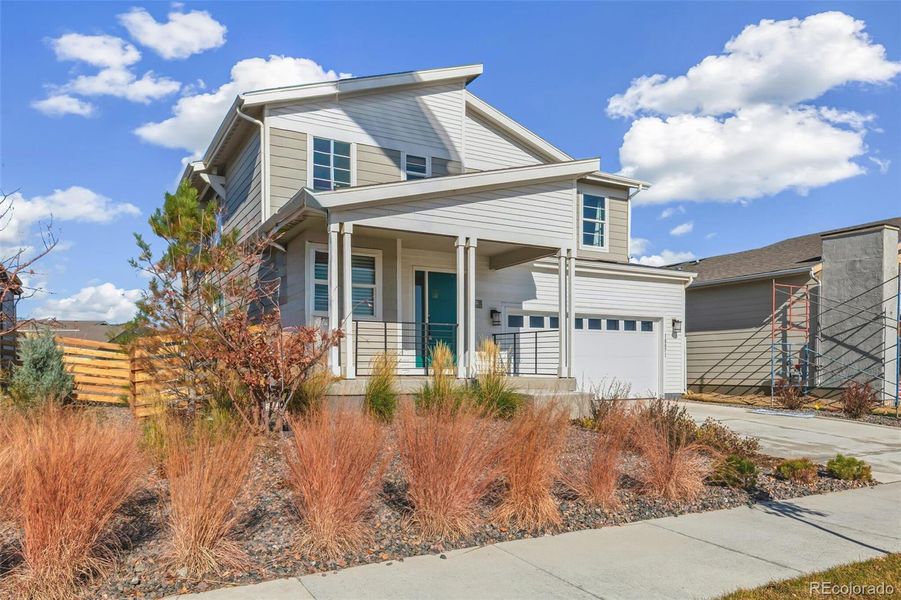 Front exterior of a new home in Legato, Commerce City, CO, highlighting curb appeal (Image 9).