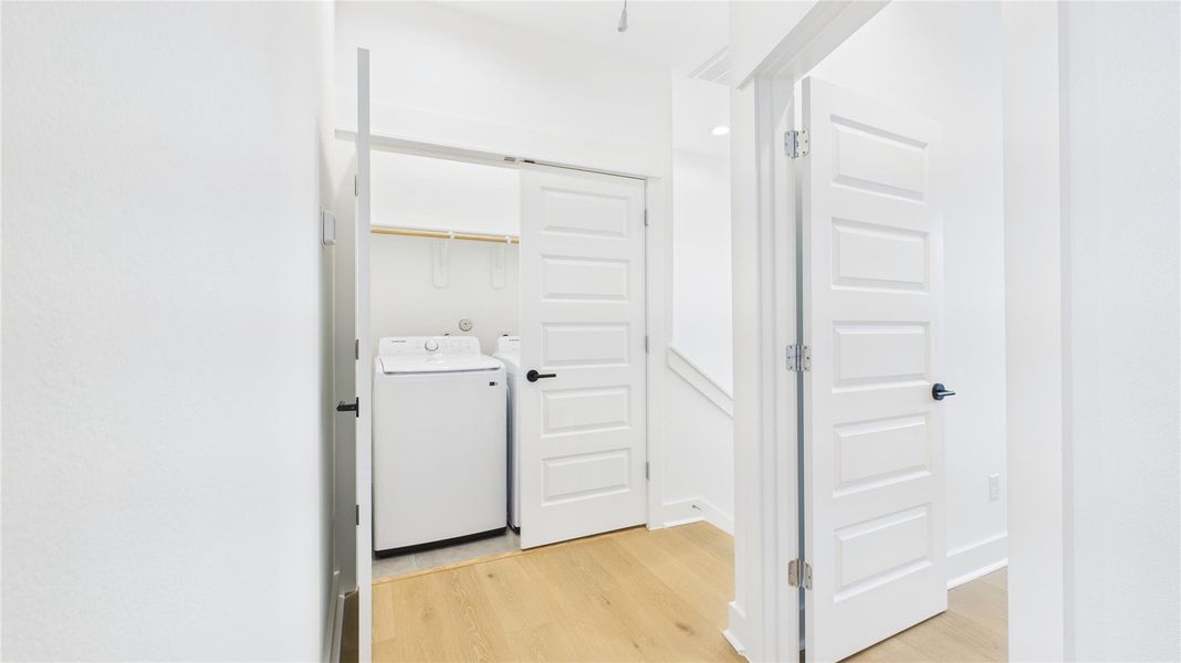 Conveniently located on hte third floor, the laundry area offers an efficient space equipped for all your laundry needs, thoughtfully designed to blend seamlessly with the home's layout for easy access and functionality.