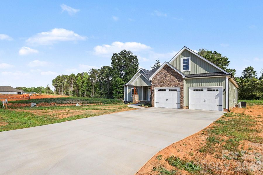 Front exterior of a new home in , China Grove, NC, highlighting curb appeal (Image 2). Front exterior of a new home in , China Grove, NC, highlighting curb appeal (Image 2).