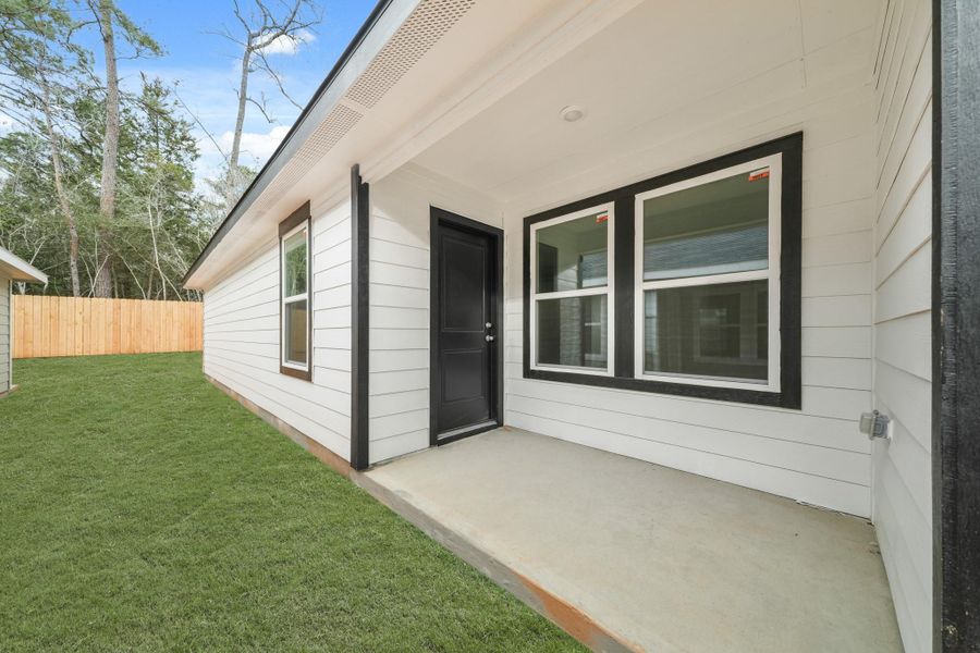Exterior details and patio area of a home in William Trails, Willis (Image 4). Exterior details and patio area of a home in William Trails, Willis (Image 4).