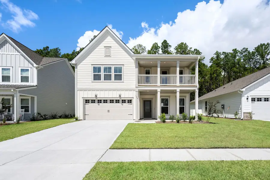 Front exterior of a new home in Waterways, Richmond Hill, GA, highlighting curb appeal (Image 25).