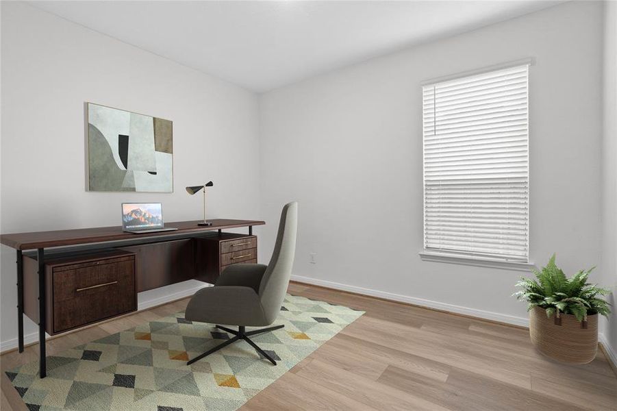 Quietly nestled in front of the home is the handsome den that is used here as a home office. Featuring gorgeous vinyl plank flooring, custom paint and a large window with privacy blinds.