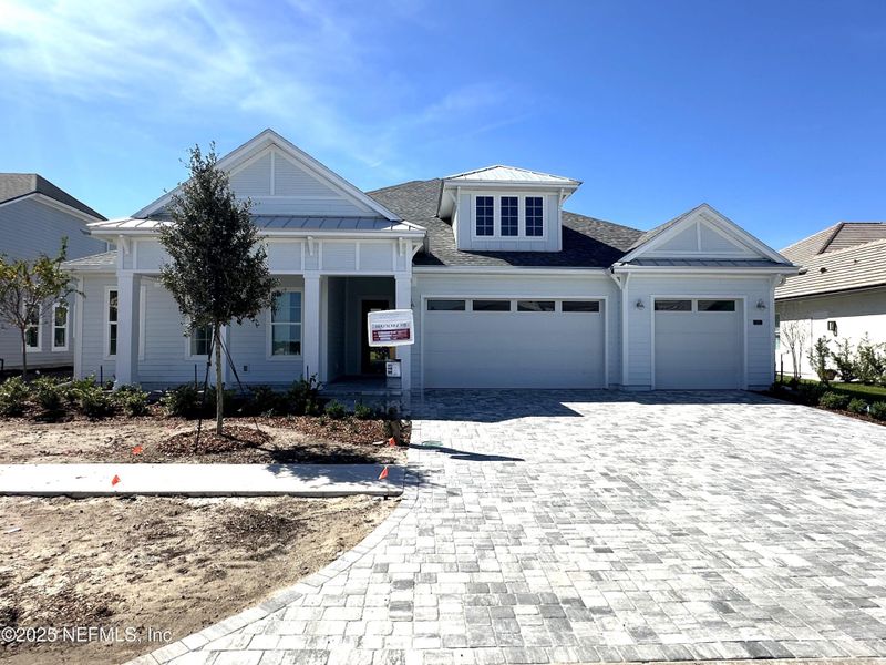 Front exterior of a new home in Madeira, St. Augustine, FL, highlighting curb appeal (Image 1).