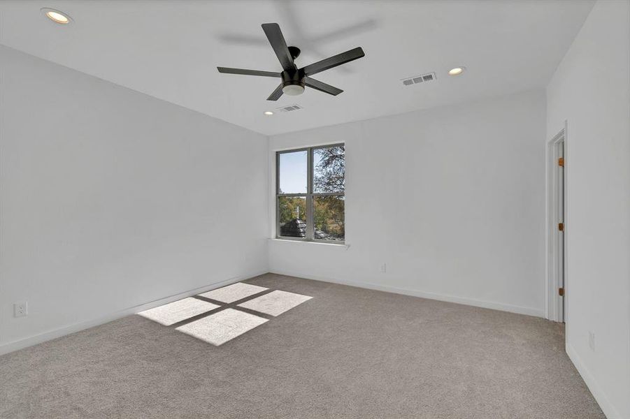 Unfurnished room with light carpet, recessed lighting, and a ceiling fan
