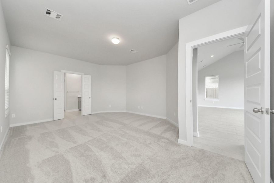 Come and unwind after a long day in this magnificent primary suite! This spacious room features plush carpet, warm paint, high ceilings and large windows with privacy blinds. Come and unwind after a long day in this magnificent primary suite! This spacious room features plush carpet, warm paint, high ceilings and large windows with privacy blinds.