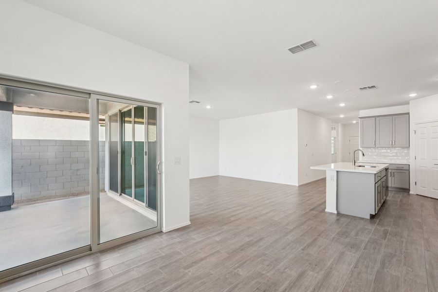 Dining into kitchen and great room. Finishes and options may vary by community