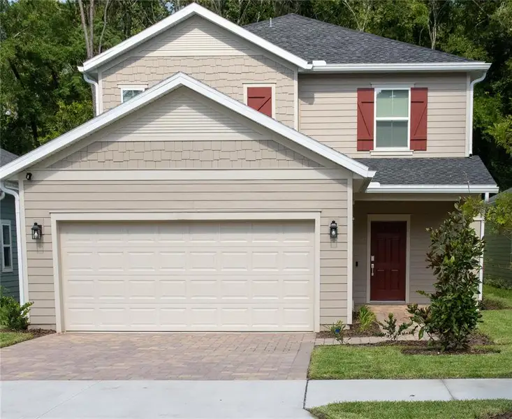Front exterior of a new home in , Gainesville, FL, highlighting curb appeal (Image 1).