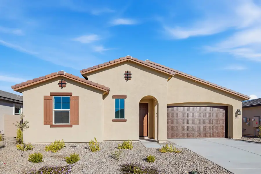 Front exterior of a new home in Marbella at Windrose, Waddell, AZ, highlighting curb appeal (Image 1). Front exterior of a new home in Marbella at Windrose, Waddell, AZ, highlighting curb appeal (Image 1).