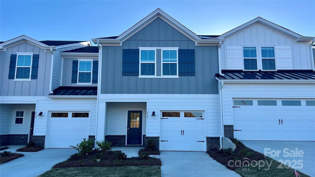 Front exterior of a new home in , Fort Mill, SC, highlighting curb appeal (Image 1). Front exterior of a new home in , Fort Mill, SC, highlighting curb appeal (Image 1).