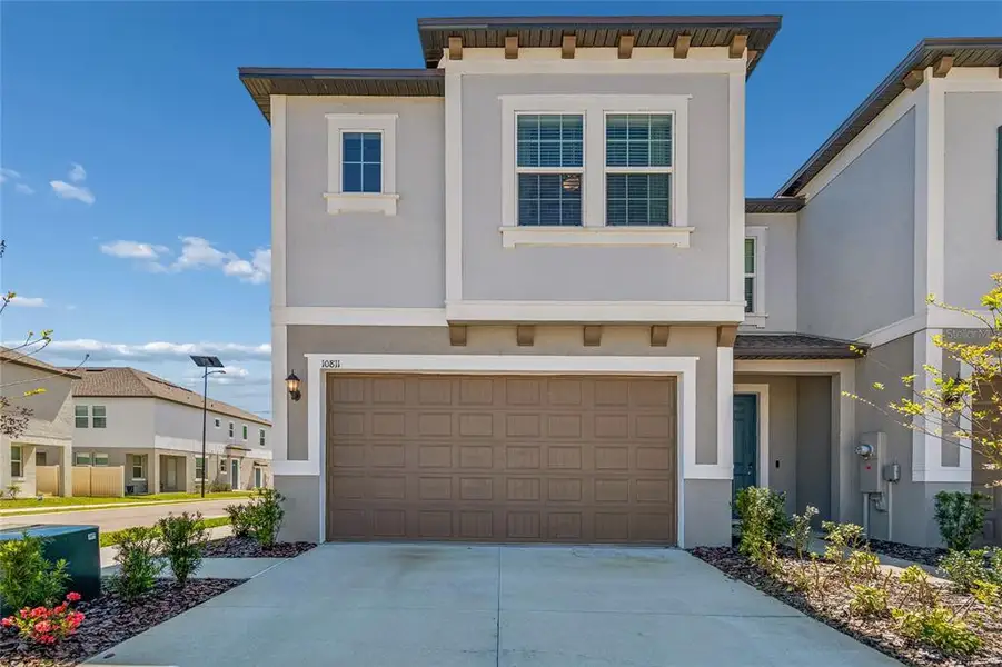 Front exterior of a new home in , Tampa, FL, highlighting curb appeal (Image 1). Front exterior of a new home in , Tampa, FL, highlighting curb appeal (Image 1).