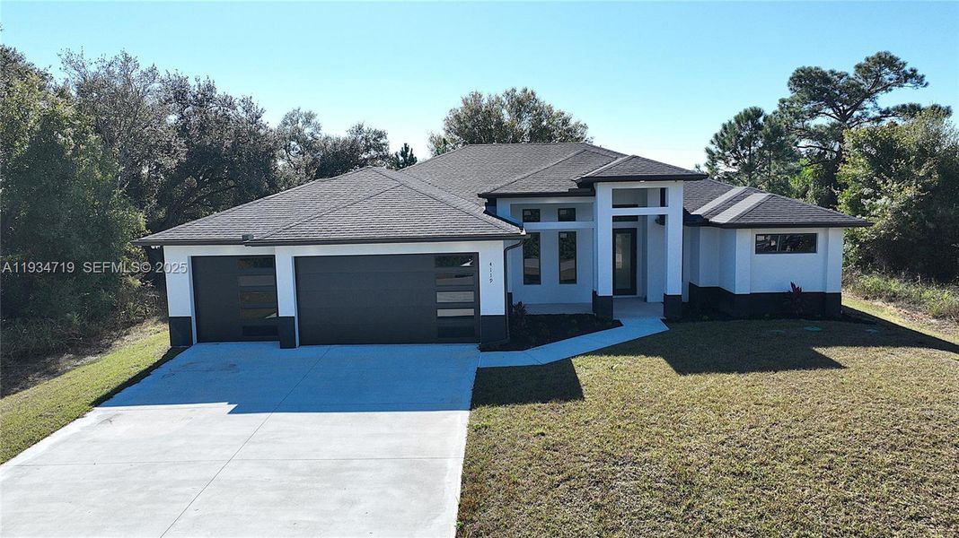 Front exterior of a new home in , Lehigh Acres, FL, highlighting curb appeal (Image 27).