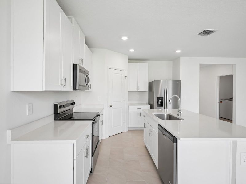 Furnished interior view inside a new home in The Reserve at Van Oaks, Auburndale (Image 7).