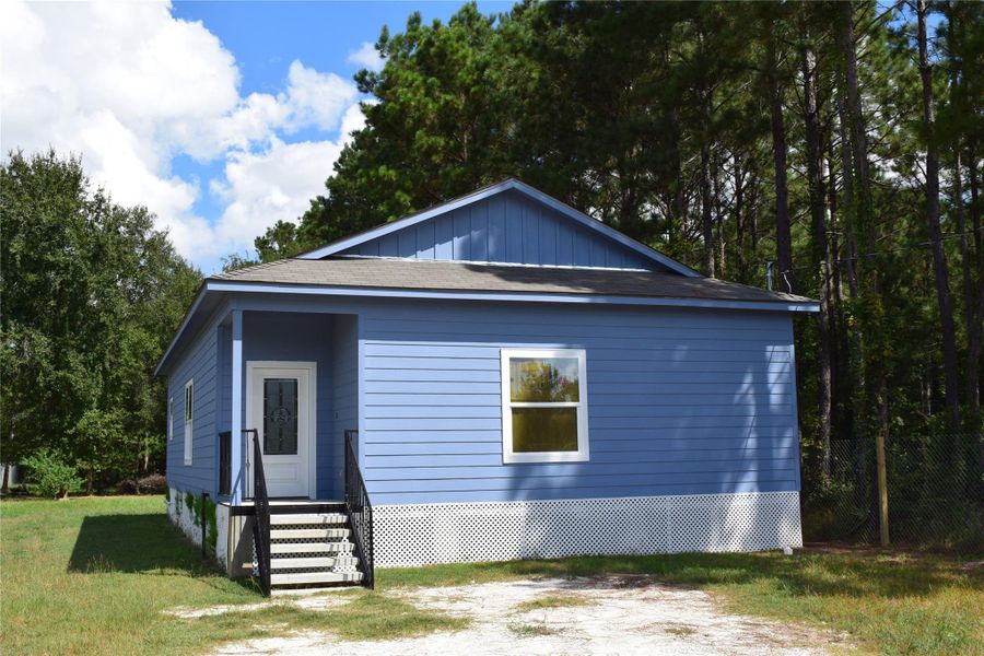 Front exterior of a new home in , Cleveland, TX, highlighting curb appeal (Image 14).