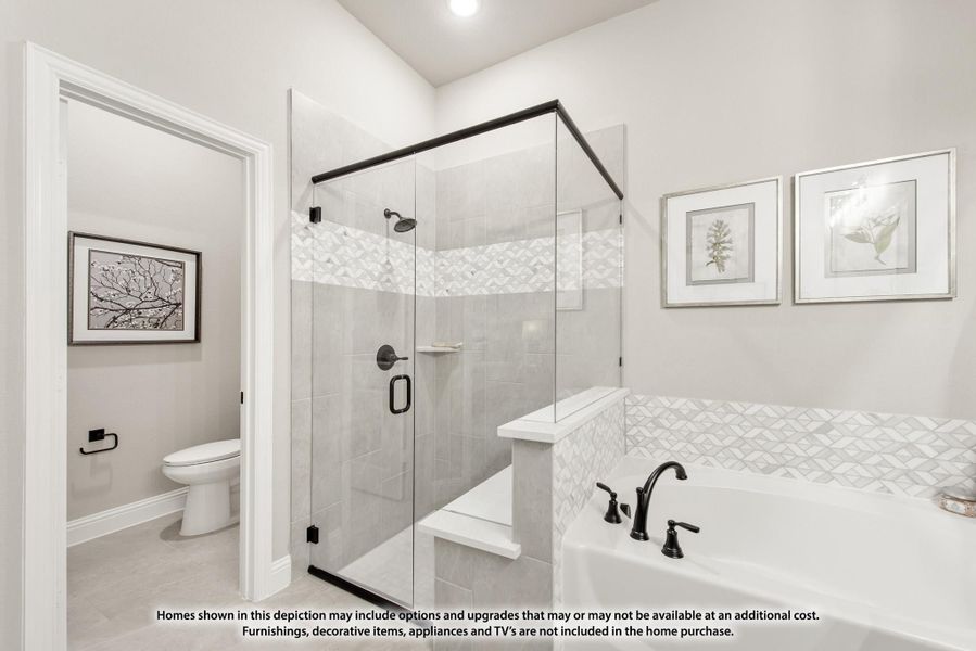 Master bathroom with glass walk-in shower, soaking tub with decorative tile, and separate water closet