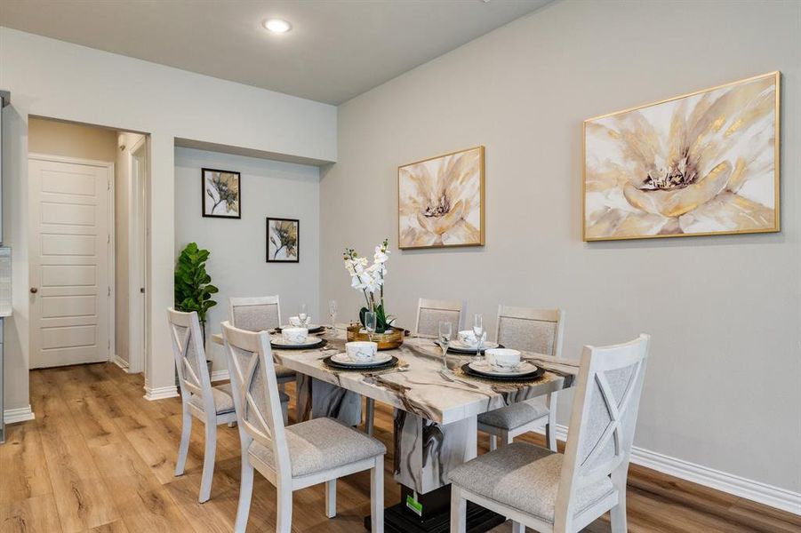 Dining space featuring light wood-type flooring