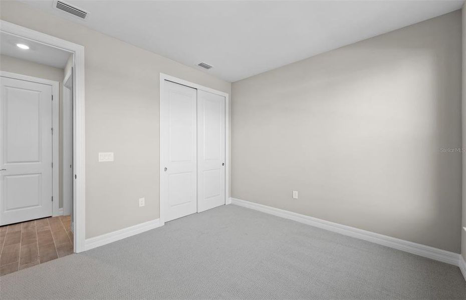 Spacious, unfurnished interior of a new home in Cedar Grove at The Woodlands, North Port (Image 26).
