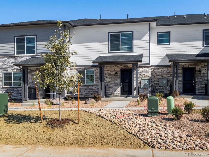 Front exterior of a new home in Skyview at High Point, Aurora, CO, highlighting curb appeal (Image 2).