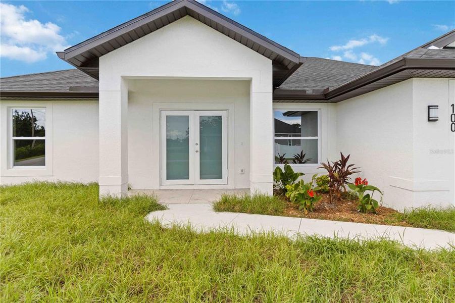 Front exterior of a new home in , Rotonda West, FL, highlighting curb appeal (Image 19).