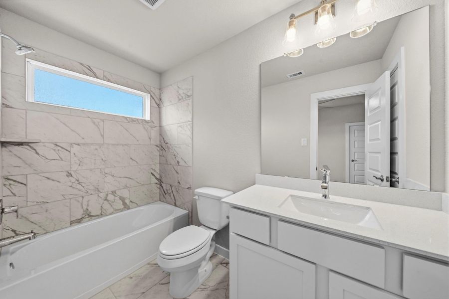 Furnished interior view inside a new home in Barton Creek Ranch, Conroe (Image 9).